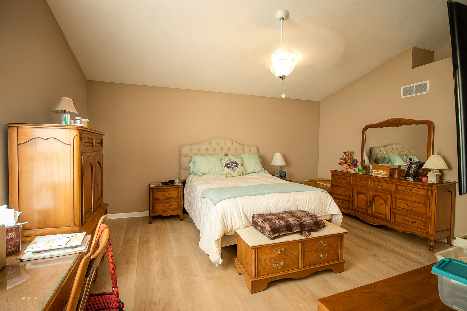 Bright interior living room with large windows and staged furniture.